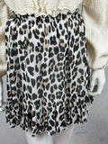 Kurzer Leo Rock mit schwingendem Volantsaum in Schwarz und Beige